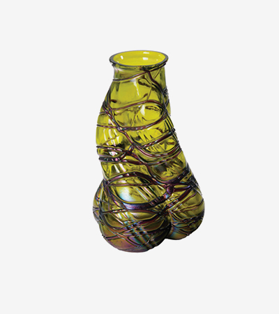Yellow vase with black line decorations. It is not a perfect shape and twists and turns up to its neck. 