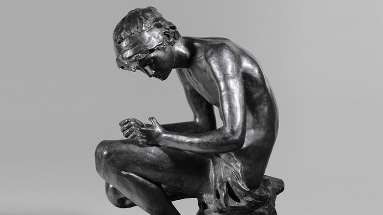 ‘Orpheus’ bronze sculpture of a man sitting looking down at his hands