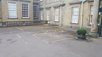 Two accessible parking spaces outside the entrance to the Hall itself.