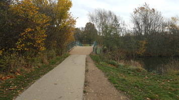 Route to Cawthorne. Path leading over a bridge towards Cawthorne Village.